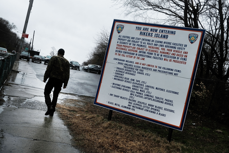A man enters the road to Rikers Island on March 31, 2017, in New York City. That month, Mayor Bill de Blasio announced that the controversial jail will be closed within the next 10 years. (Spencer Platt/Getty Images)